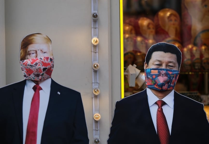 Cardboard cutouts of US President Donald Trump and Chinese President Xi Jinping wearing face masks in Moscow, Russia. REUTERS.